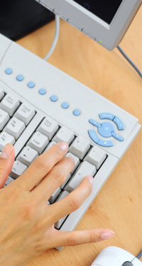 Woman's hand on numeric keypad